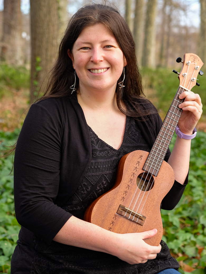 Portrait of Anna Fiveash holding an ukulele